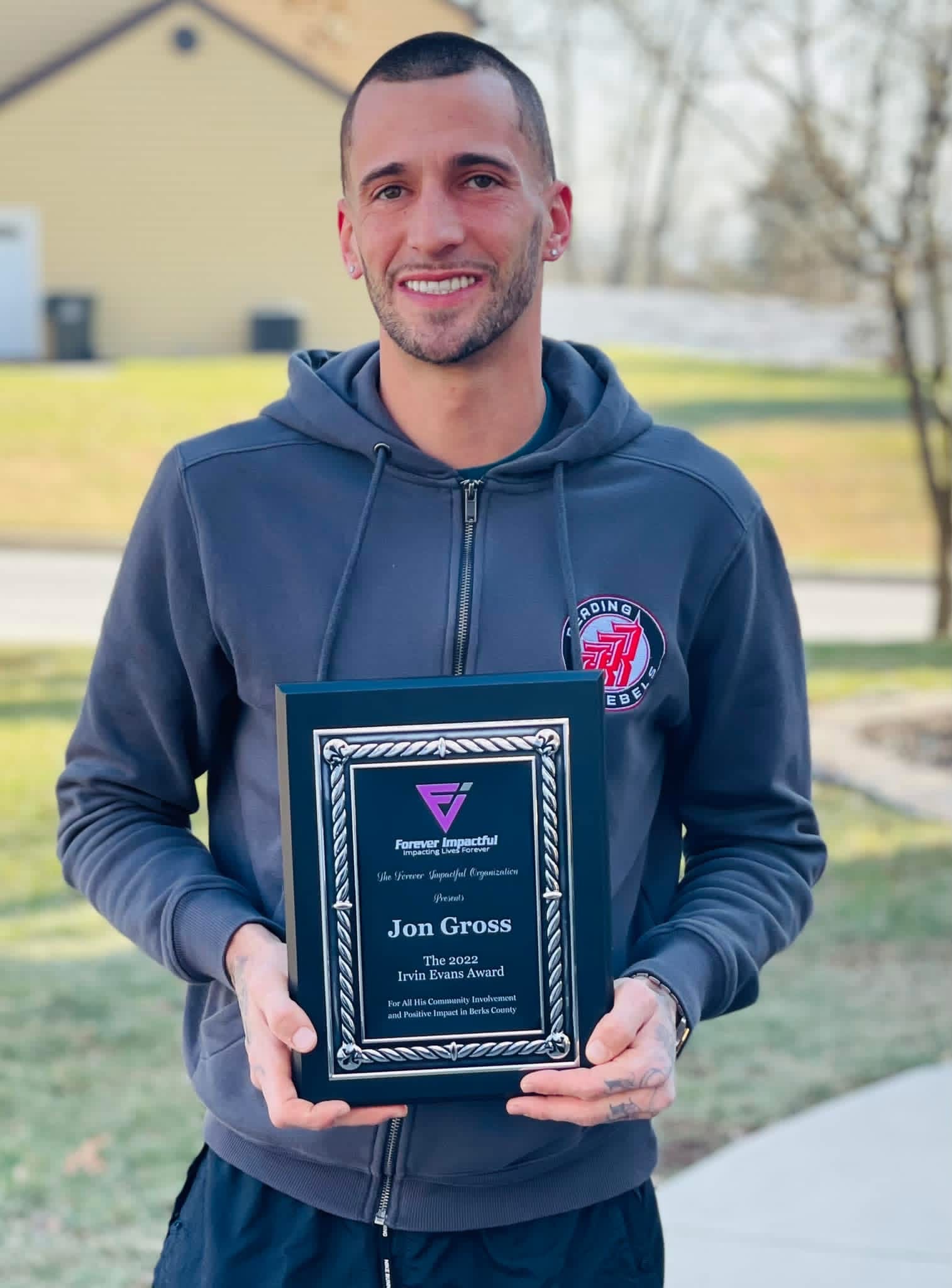 Jon Gross receiving plaque