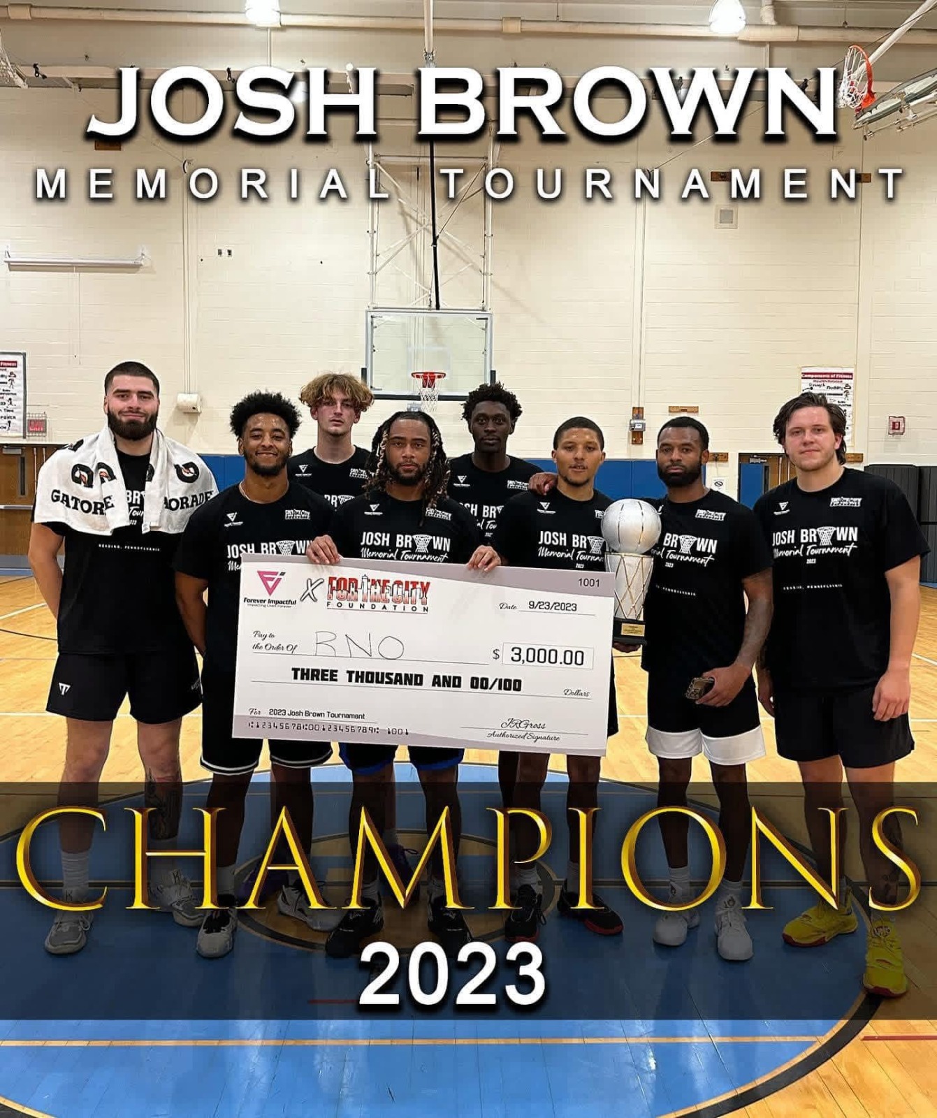 Josh Brown Tournament banner and teammates